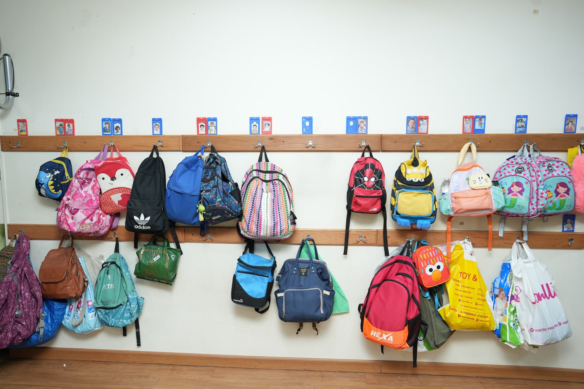 The children's bags stored neatly in the nursery