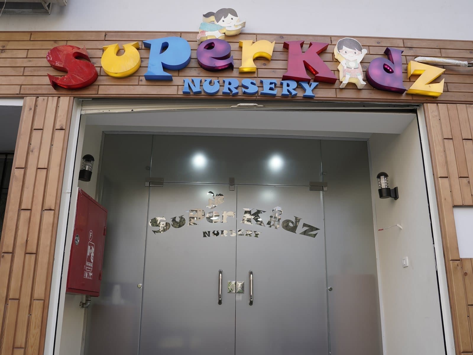 The Super Kidz entrance, with the nursery’s name in coloured letters above glass doors