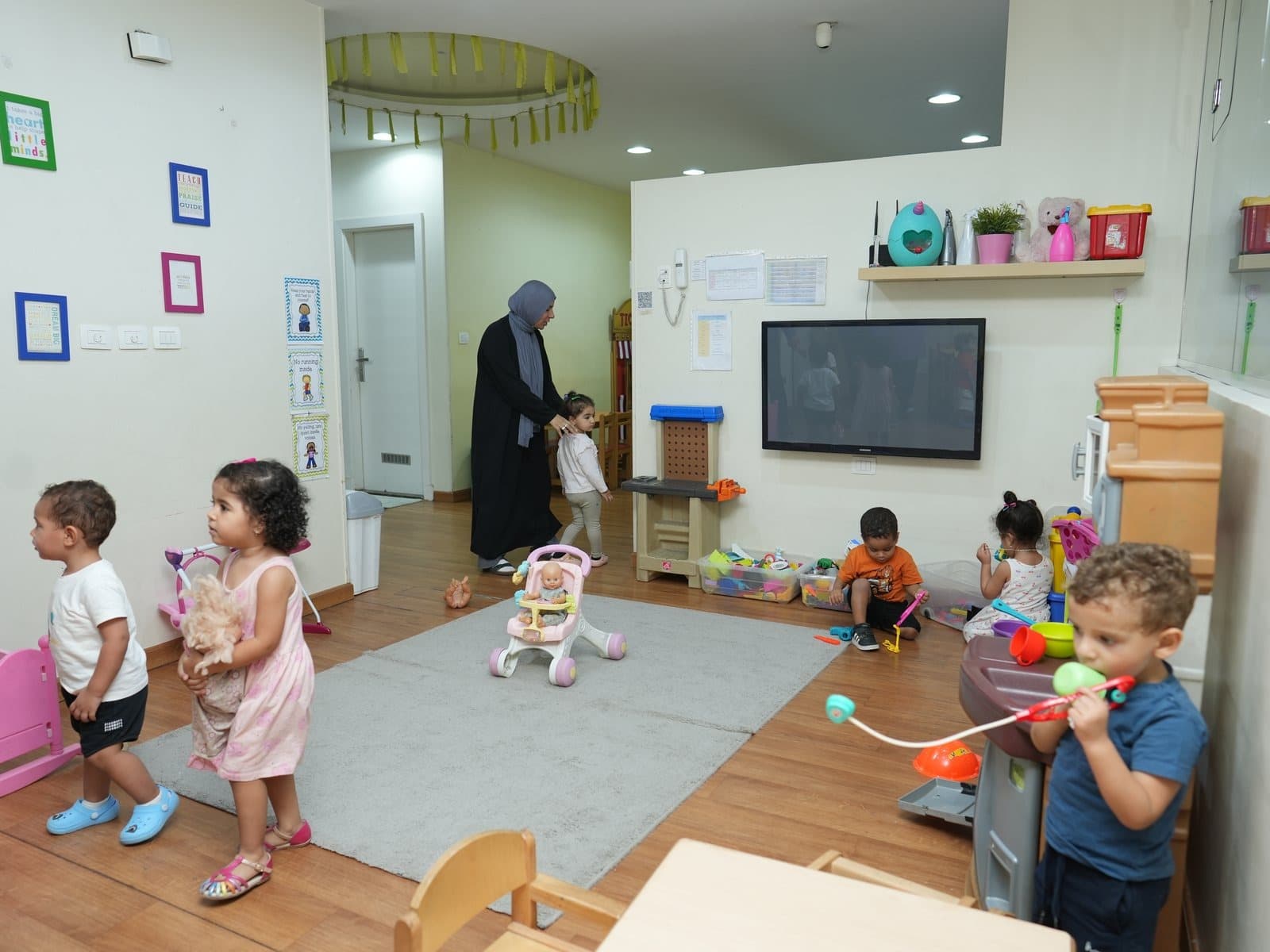 The group area with tables and space for shared activities