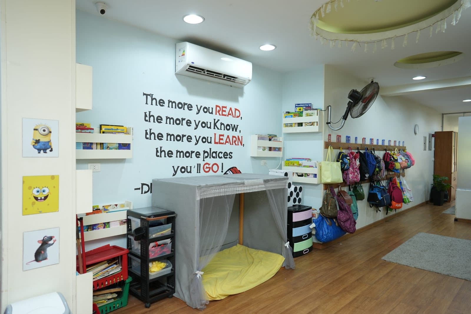 The story-telling corner, with its canopy tent, cushion and baskets of story books