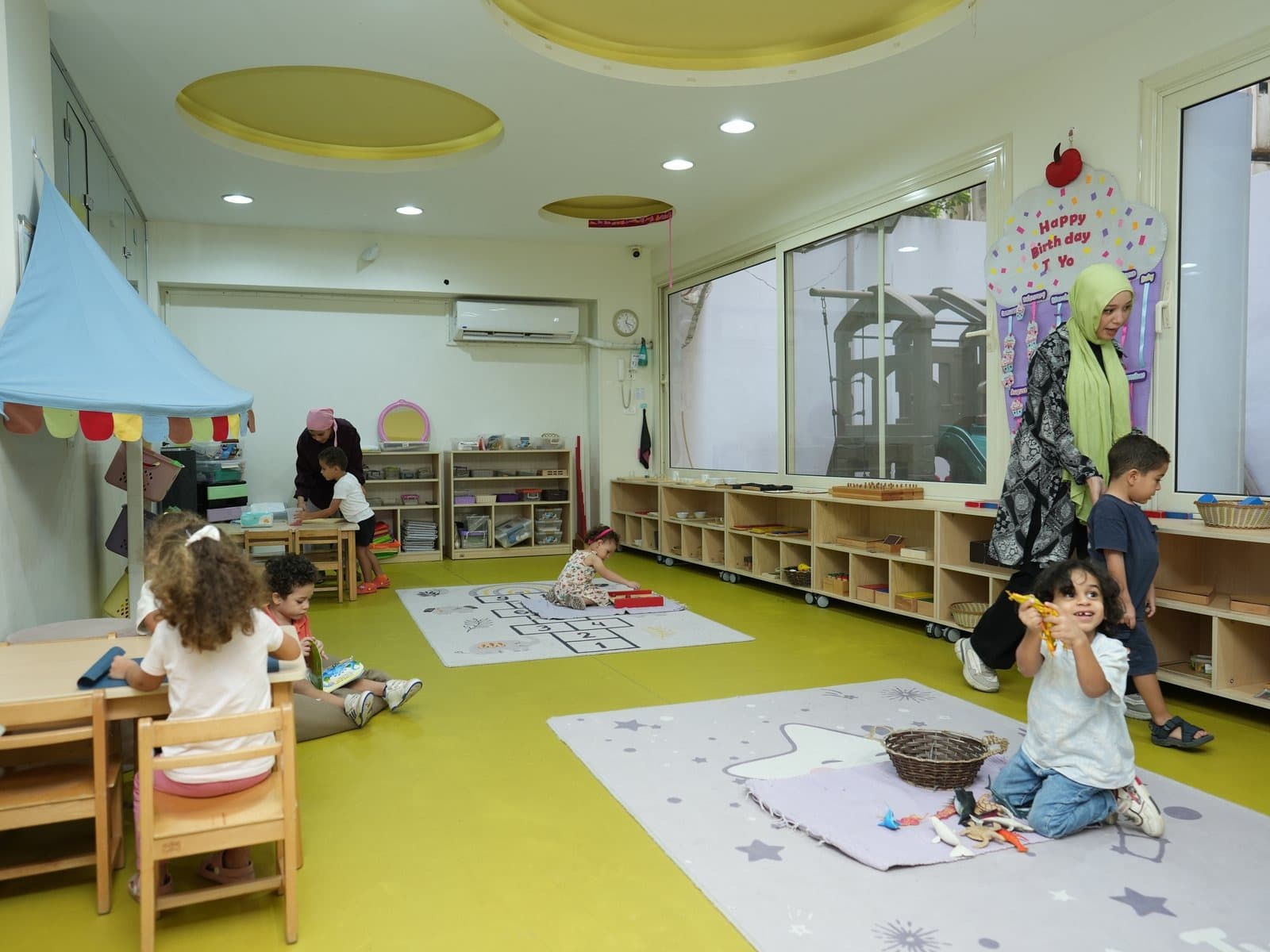 The whole group together on the rugs at circle time