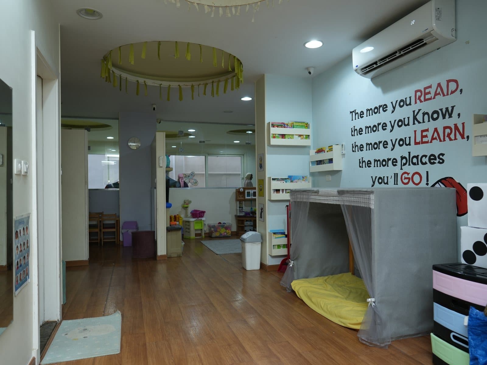 The story wall, with its reading quote and book shelves